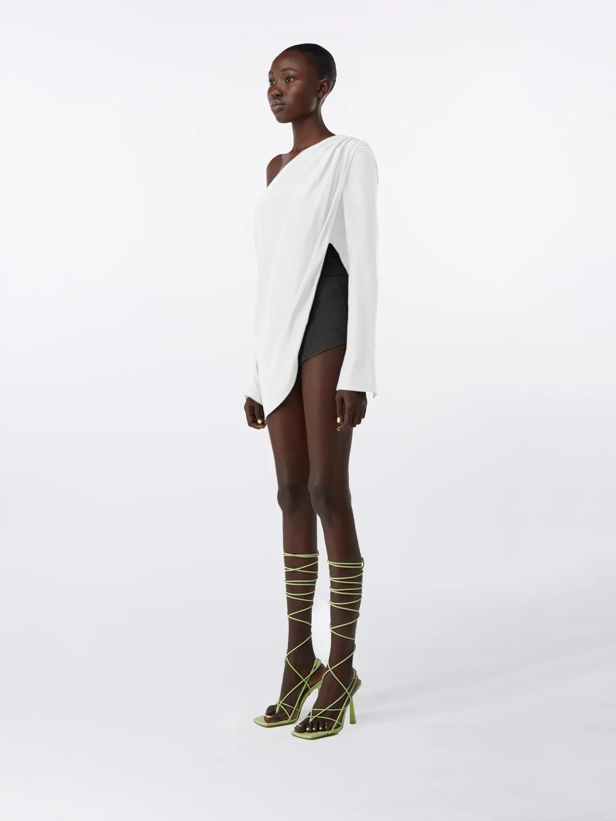 model wearing a white asymmetric long sleeve silk top