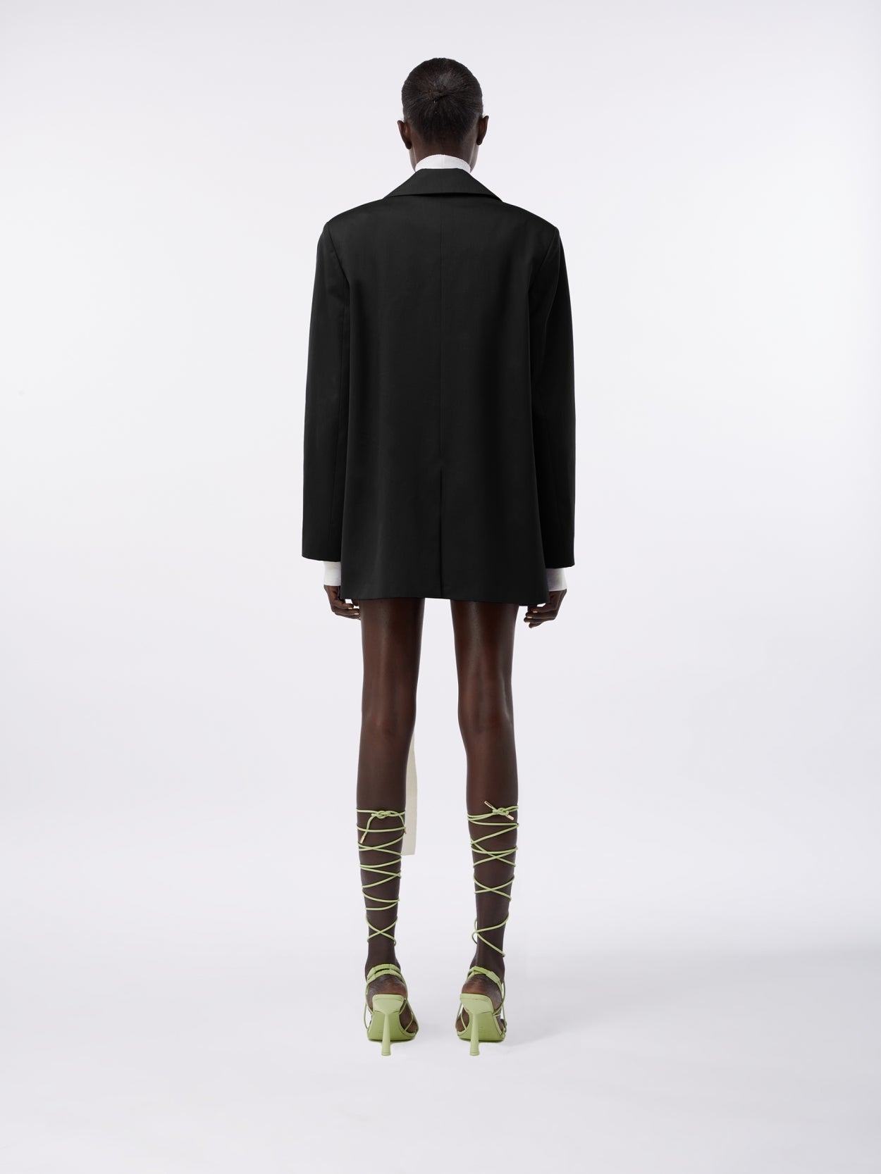 model wearing a black square blazer