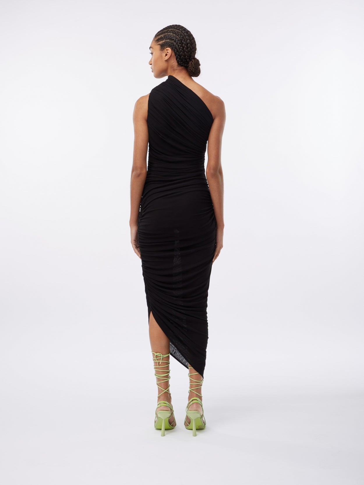 model wearing a one shoulder black draped dress