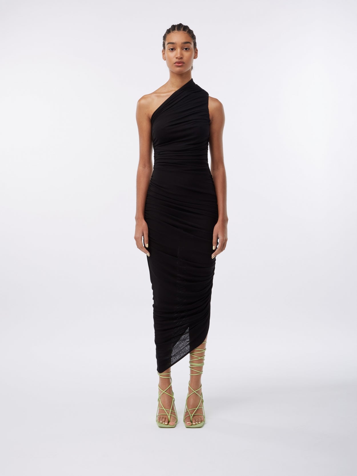 model wearing a one shoulder black draped dress